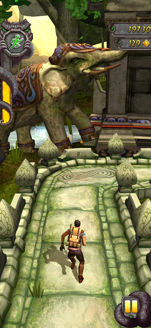 Temple Run 2: surfing down an icy mountain slope with snow.